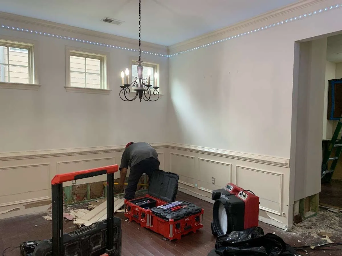 Restoration technician with professional equipment in Williston Park